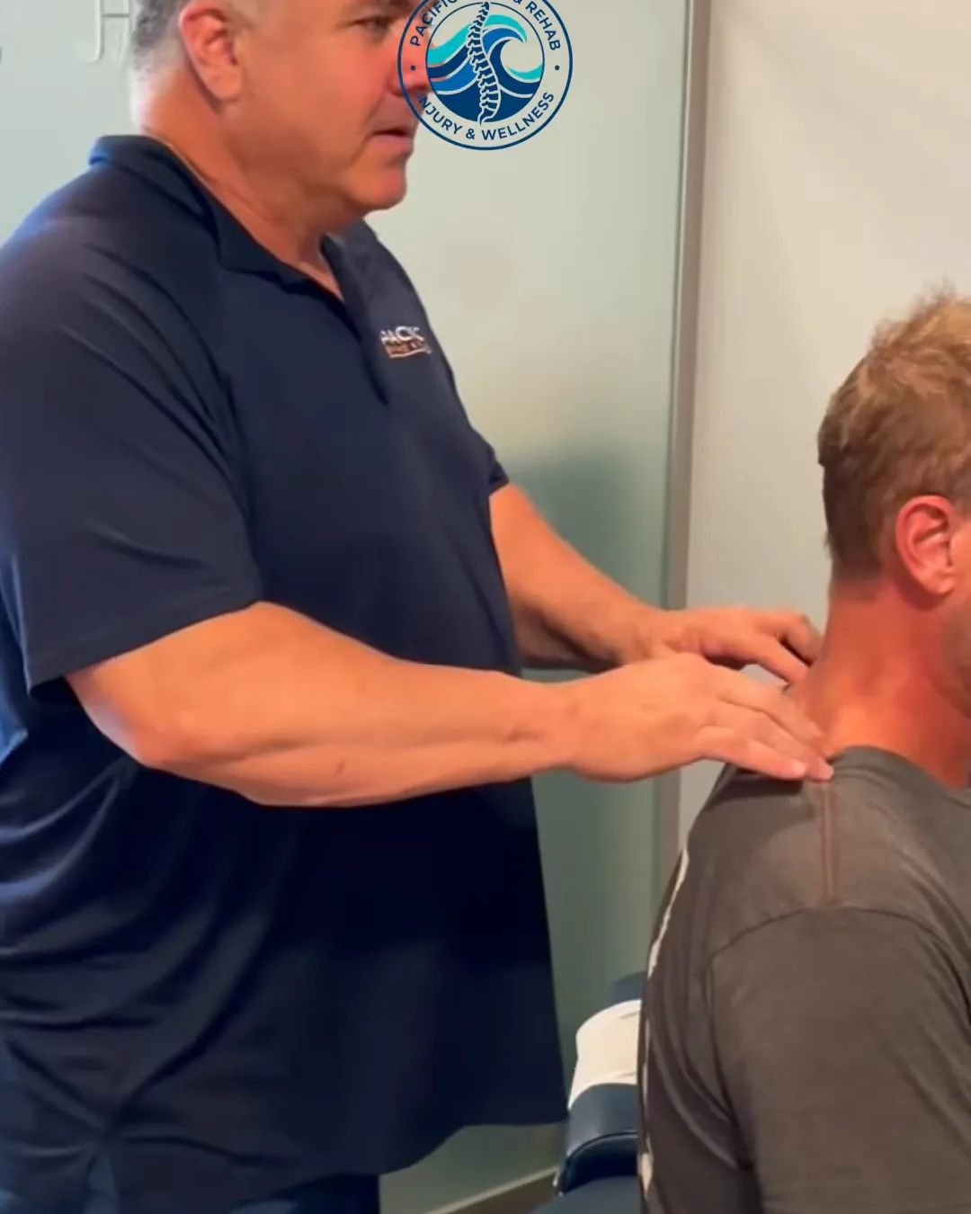Dr. Anthony Salmon, DC examining a patient's neck and shoulders in Carlsbad Dr. Anthony Salmon, DC examining a patient's neck and shoulders in Carlsbad